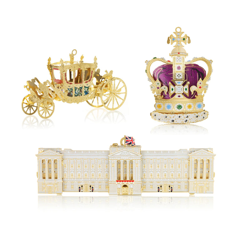 Coronation Collection Set by The London Christmas Company featuring handcrafted 24-carat gold ornaments of the Gold State Coach, St. Edward’s Crown, and Buckingham Palace. Celebrate British royal heritage with these elegant Christmas tree decorations.