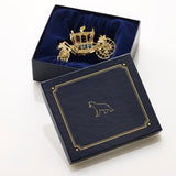 Handcrafted Gold State Coach Christmas Tree Ornament, featuring intricate 24-carat gold details. A stunning royal carriage replica by The London Christmas Company, perfect for adding British elegance to your festive decor. Seen here sitting in a gift box.